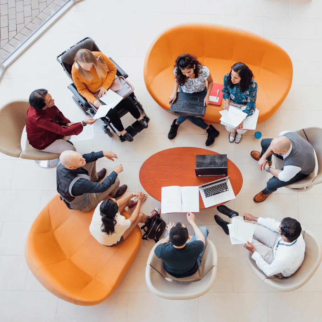 A group of people sitting in a circle having a discussion